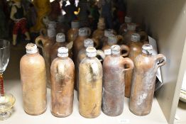 A group of 18 late 19th century Apollinaris bottles each having impressed mark 'No.43 B', h24cm.