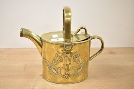 In the manner of Dr Christopher Dresser (1834-1904), A brass watering can having shaped spout,