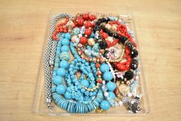 A collection of beaded costume necklaces, turquoise examples, cultured pearls and glass pieces