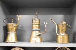 A group of three brass carbide/acetyline miners lamps, the precursor to the more recognisable safety