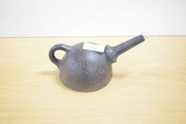 A.G.Wells & Co Cast Iron Unbreakable Moulders Lamp No 20 with wick present, length 16cm