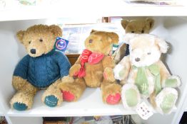 Four Harrods Year Teddy Bears, 1995 wearing green tie with tag, 1997 wearing red tie with tag,