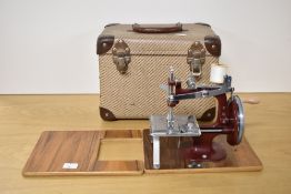 The Essex Mark II Portable Miniature Sewing Machine, in case with instructions