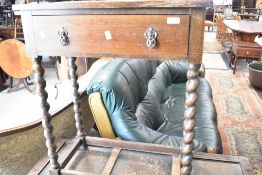 An early 20th Century oak hall table having frieze drawer amd barey twist legs, and a mid 20th