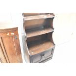 A priory style narrow bookshelf with cupboard uner, height approx. 113cm