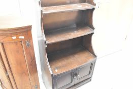 A priory style narrow bookshelf with cupboard uner, height approx. 113cm