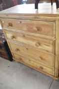 A stripped pine chest of four long drawers, width approx. 97cm