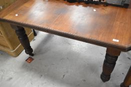 A Victorian mahogany extending wind out dining table , with extra leaf (no winder)
