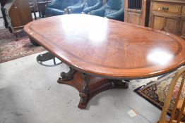 A nice quality reproduction oval dining table having scroll base, approx. 230 x 110cm