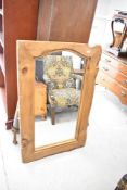 A rustic wall mirror having chunky natural wood frame, approx. 109 x 70cm