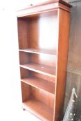 A modern mahogany effect narrow bookshelf, height approx. 181cm