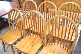 A set of six rubberwood hoop and stick back kitchen chairs