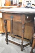 A late 19th or early 20th Century oak demi lune hall table