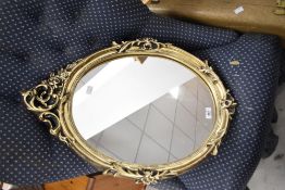 A modern gilt frame wall mirror, height approx. 65cm