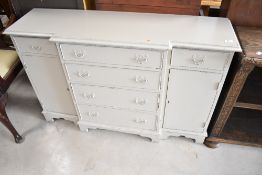 A reproduction breakfront sideboard of small proportions having painted finish, width approx. 120cm