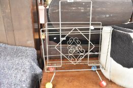 A vintage 'atomic' magazine rack