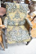 An early 20th Century mahogany framed carver chair having later Morris style upholstery