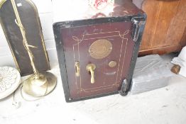 A vintage cast iron safe , Phillips and Son, open but no key