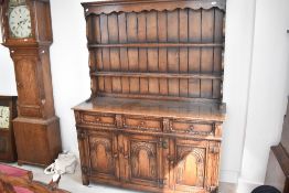 A traditional Titchmarsh and Goodwin oak dresser, width approx. 139cm