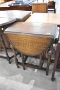 An early 20th Century oak gateleg occasional table, width approx. 62cm