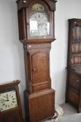 A 19th Century oak and mahogany longcase clock having eight day movement and painted dial, with