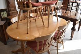 A modern limed oak dining table and six similar chairs, labelled for Philip Greenwood