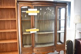 An Edwardian dispplay cabinet having bowed centre section, width approx. 122cm