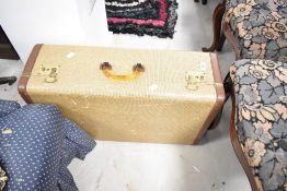 A vintage travel case, tweed effect