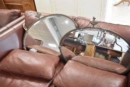 Two traditional brass framed mirrors having urn and swag decoration