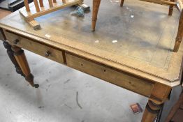 A Victorian desk having skiver top and double drawer, width approx. 122cm