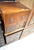 Two modern hardwood four drawer CD, bedside or similar storage chests