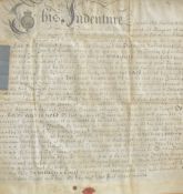 An 18th century framed indenture, written December 16th 1736, later mounted and framed, under