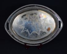 An Edwardian silver presentation tray, of oval form having an egg and dart style rim with half