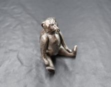 An Edwardian silver novelty pin cushion, modelled as an articulated 'bait bear', having paste set