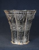 A large Indian white metal planter, of fluted form having a lobed rim with floral and rope