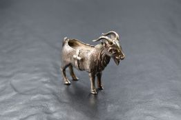 An Edwardian silver novelty pin cushion, modelled as a goat, missing the cushion to the back,