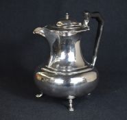 An Edwardian silver coffee pot, of bulbous form having a Chippendale style rim, small narrow opposed