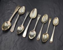 A group of eight silver Old English and Queen's pattern teaspoons, marks to include London,