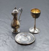 A cased Victorian silver travelling communion set, comprising a small chalice, flask and plate,