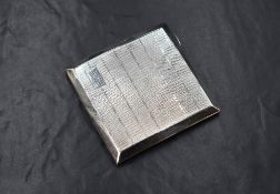 A George V silver cigarette case, of hinged square form having engine turned decoration and