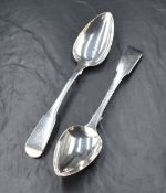 A pair of George III silver fiddle pattern serving spoons, having 'T' initial to the terminals,