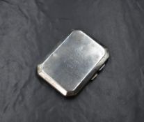 A George V silver cigarette case, of hinged rectangular form, having a personalised engraving to the