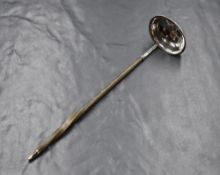 A William IV silver and baleen toddy ladle, of traditional form having a silver ladle with a twisted