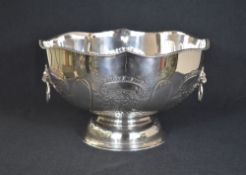 An impressive silver plated punch bowl, having a lobed gadrooned decorated rim, floral scroll