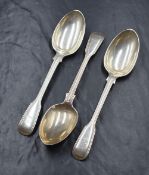 A group of three Victorian silver fiddle and thread pattern spoons, having heraldic crests to the