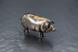An Edwardian silver novelty pin cushion, modelled as a pig, having dark fabric to the body, marks