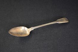 A William IV silver fiddle and thread pattern serving spoon, having a heraldic crest to the