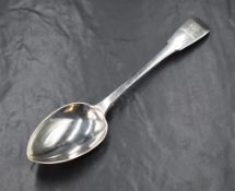 A George III silver fiddle pattern serving spoon, having a heraldic crest to the terminal, marks for