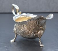An Irish George V silver sauce boat, of traditional form having Chippendale style rim, scroll handle