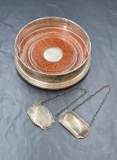 An Elizabeth II silver wine coaster, of traditional form having step moulded decoration, marks for